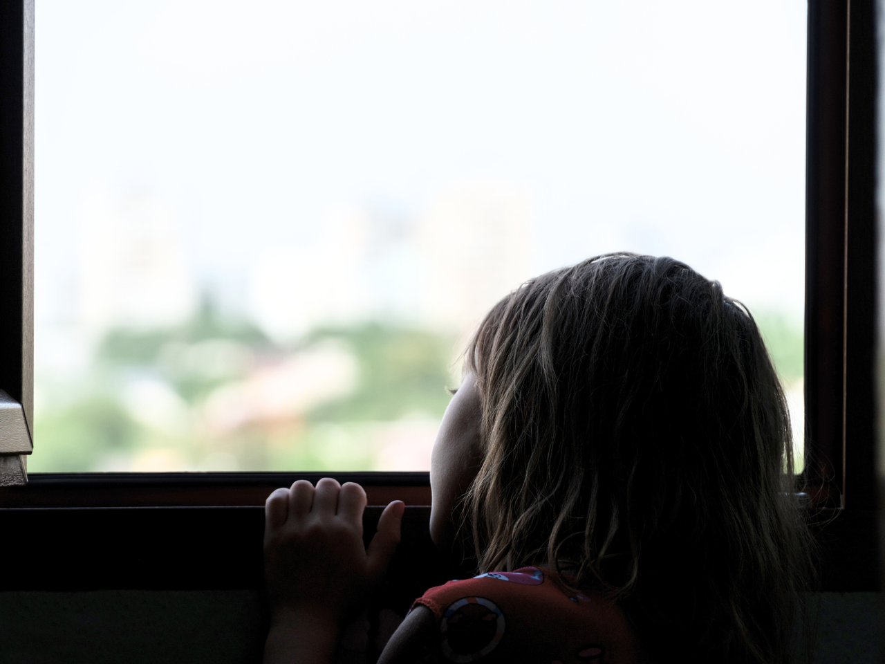 child looking out the window