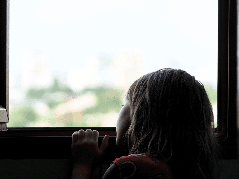 child looking out the window