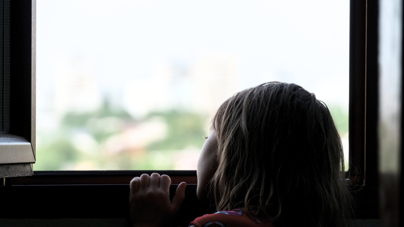 child looking out the window