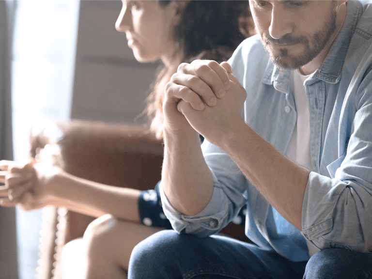 couple facing away from each other